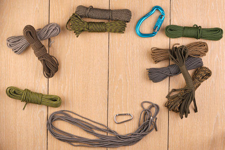 cord strong paracord tactical, tourist 550, on wood-tile. Carbinesの写真素材