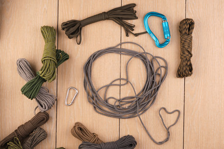 cord strong paracord tactical, tourist 550, on wood-tile. Carbinesの写真素材