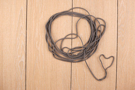 cord strong paracord tactical, tourist 550, heart, on wood-tileの写真素材