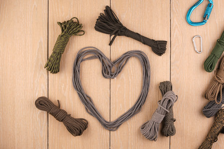 cord strong paracord tactical, tourist 550, on wood-tile. Carbinesの写真素材