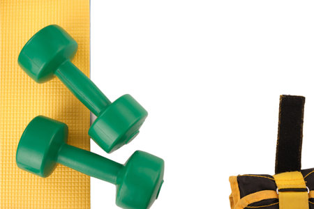 Dumbbells green isolate, leg weights black and yellow, fitness, sport, exercise, fitness mat, frameの写真素材