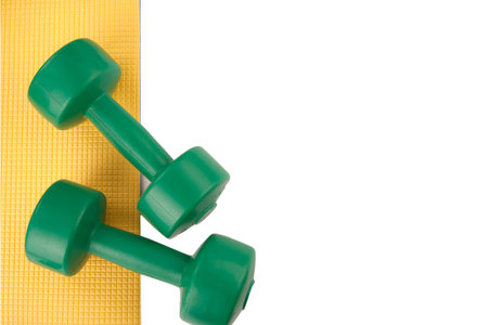 Dumbbells green isolate, leg weights black and yellow, fitness, sport, exercise, fitness mat, frameの写真素材
