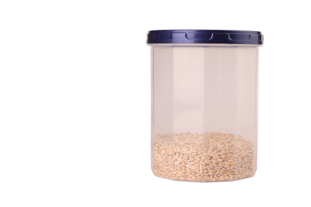 pearl barley in plastic jars isolateの写真素材