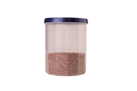 buckwheat groats in plastic jars isolateの写真素材