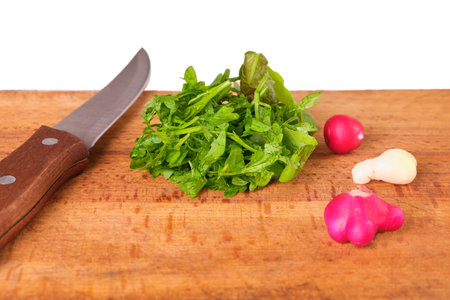 watercress salad, radish, knife on wooden board isolate, fresh, naturalの写真素材