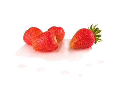 4 ripe strawberries berries isolate in water, reflection. natural from the garden. Strawberry with root, leavesの写真素材