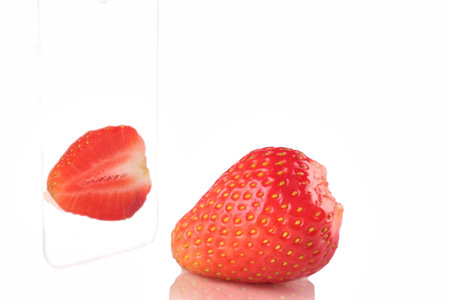strawberry berries ripe and half reflection, isolate. natural from the gardenの写真素材