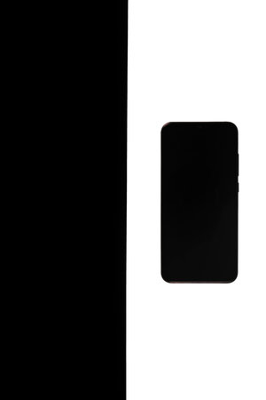 the smartphone is black isolated, white and black backgroundの写真素材