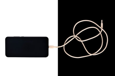 usb cables micro, white isolated, the smartphone is blackの写真素材