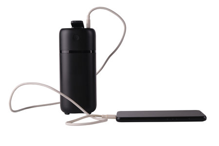 powerbank black isolated on a white background, usb cables, smartphone, plugの写真素材