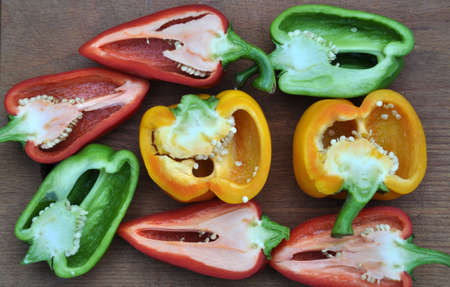Sliced peppers are sweet on the wooden kitchen board