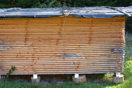 Raw wood under cover in the fresh air dries naturally