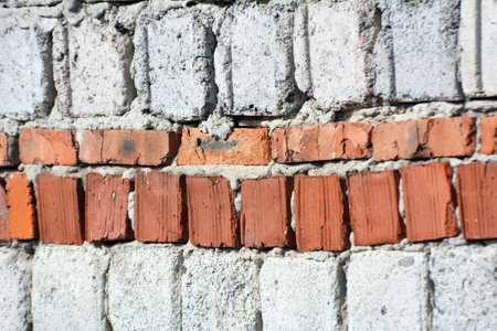 A fragment of the masonry wall of the buildingの写真素材