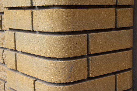 A fragment of decorative masonry of a brick wall