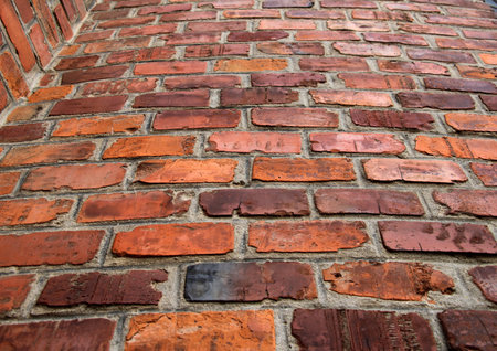 A fragment of decorative masonry of a brick wallの写真素材