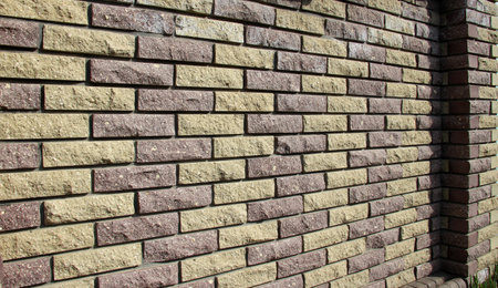 A fragment of decorative masonry of a brick wall