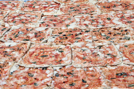 A very big pizza, made up of many pieces