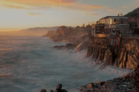Promenade di Nervi, on the east coast of Genoa, with the waves of the rough sea breaking on the...