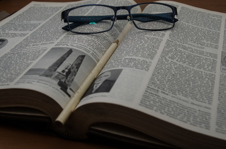 book  and  glasses  separate pagesの写真素材