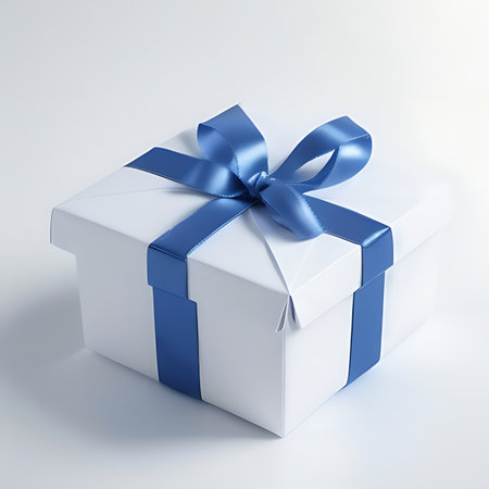White gift box with blue ribbon on white background. 3d renderの素材