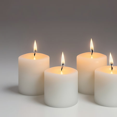 Three candles on a gray background. 3d rendering. Computer digital drawing.の素材