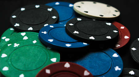 a lot of poker chips on a black backgroundの写真素材