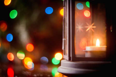 Bright Christmas lamp on wooden backgroundの写真素材