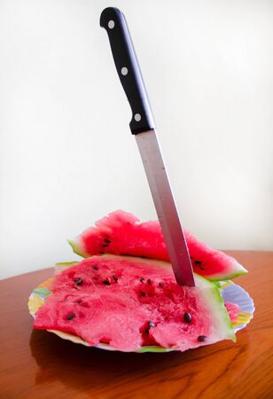 Delicious watermelon with a knifeの写真素材