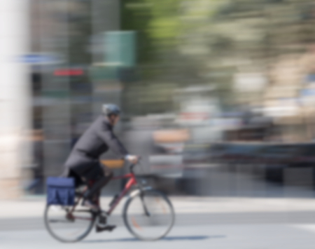 cyclists in the city, blurred, moving with Copy Space