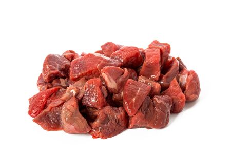 Heap of raw beef goulash isolated on white background, front view, closeupの写真素材