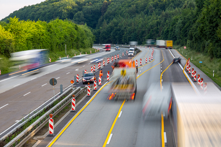Idstein, Germany, Highway Autobahn 3, May 28th, 2018 - A german autobahn highway construction site with trucks and cars passing the dangerous areaのeditorial素材