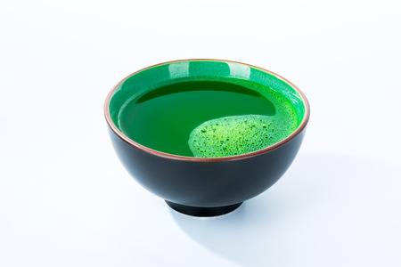 Cup of matcha green tea on white backgroundの写真素材