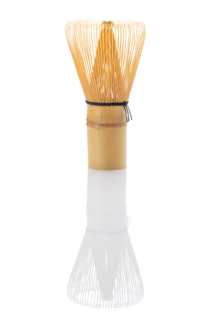 Japanese green matcha tea bamboo whisk isolated on white background with reflectionの写真素材