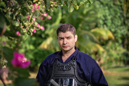 Portrait of a man in a kimono in the garden