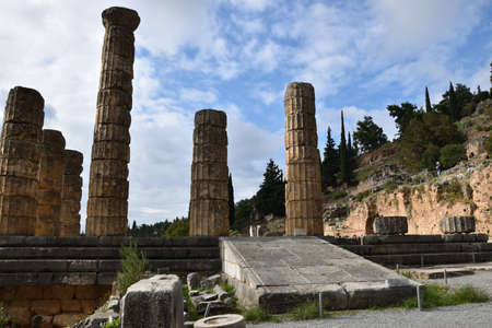 View of the main monuments of Greece. Ruins of Delphi, on Mount Parnassus. Oracle of Delphi. Old stone wall with inscriptionsの写真素材