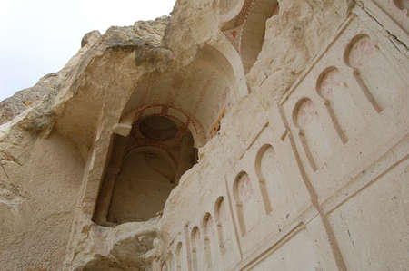 Valley of Goreme, in Cappadocia (Central Anatolia, Turkey). Ancient rock-cut Christian Byzantine churches. Old paintings. Fairy chimneysの写真素材