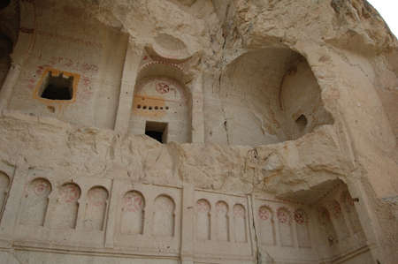 Valley of Goreme, in Cappadocia (Central Anatolia, Turkey). Ancient rock-cut Christian Byzantine churches. Old paintings. Fairy chimneysの写真素材