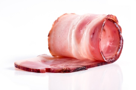 raw bacon isolated on a white backgroundの写真素材