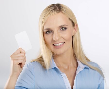 woman holding a blank card