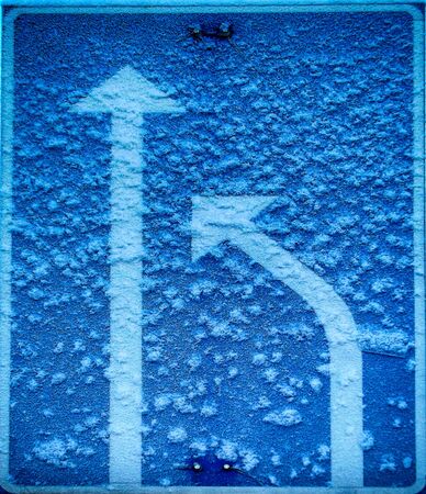 Lanes merging traffic sign with a bit frost on it.