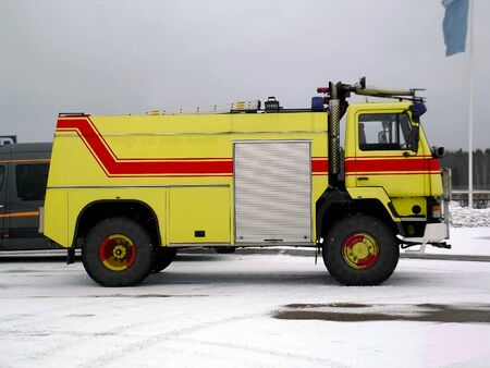 Fire engine stands at the Helsinki-Malmi airport parking lot.