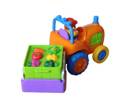 Children s toy Colored small tractor with a truck carrying a load of fruitの写真素材