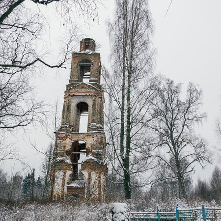 the bell tower was destroyed in the winter Church of the ascension on the river Meuse, in the village of Bychikha, Kostroma oblast, Russiaの写真素材