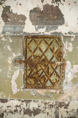 the door of an old stove in an abandoned templeの写真素材