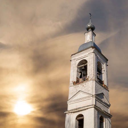 the tower of a brick bell tower against the skyの写真素材