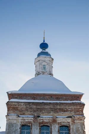 the village Church of red bricks in the winter village Jvalovo, Kostroma oblast, Russiaの写真素材