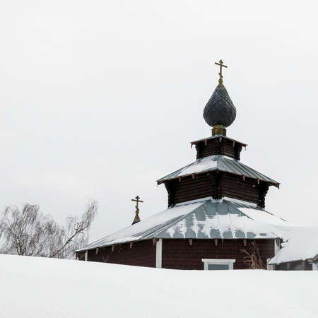 little church among the snow, village of Ivanovskoye, Kostroma region, Russiaの写真素材