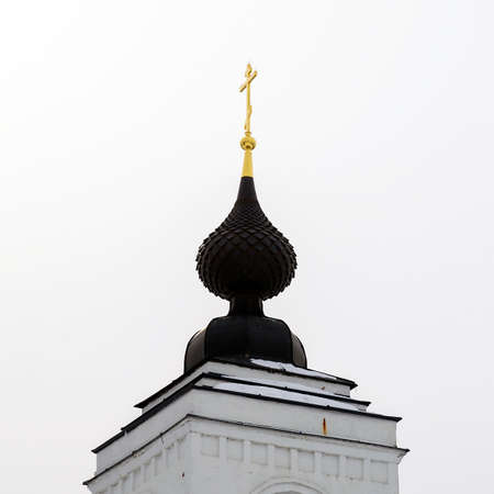 onion dome with a golden cross, on the roof of an Orthodox churchの写真素材