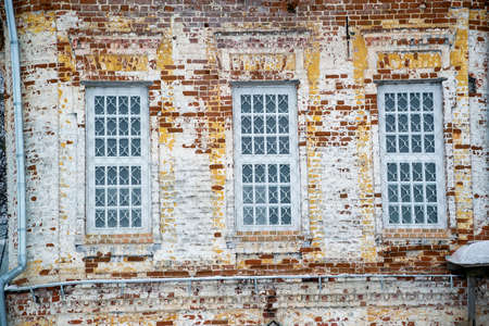 brick church wall with windowsの写真素材