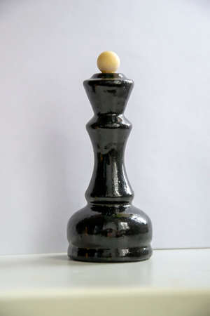 a lone chess piece on a white backgroundの写真素材